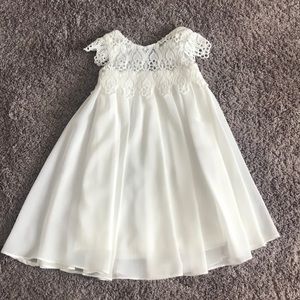 Lined ivory dress with detailed collar.